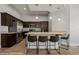 Kitchen featuring stainless steel appliances, granite counters and four bar stools at 260 Haley Way # 157, Mesquite, NV 89027