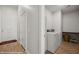Functional laundry room featuring a washer, dryer, utility sink, and ample storage space for convenience at 260 Haley Way # 157, Mesquite, NV 89027