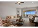 Bright living room with neutral tones, comfortable seating, and sliding glass doors to the patio at 260 Haley Way # 157, Mesquite, NV 89027