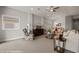 Spacious living area featuring a ceiling fan, plush furniture, and seamless flow to the dining space at 260 Haley Way # 157, Mesquite, NV 89027