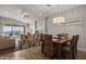 Open living room with sliding glass doors, ceiling fan, dining table and neutral decor at 260 Haley Way # 157, Mesquite, NV 89027