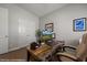 This is an office space featuring a stylish wooden desk and comfortable seating at 260 Haley Way # 157, Mesquite, NV 89027
