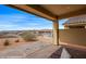 Relaxing covered patio with chairs and panoramic views of the desert landscape and community at 260 Haley Way # 157, Mesquite, NV 89027