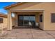 Covered patio with sliding glass doors and seating area providing comfort and style at 260 Haley Way # 157, Mesquite, NV 89027