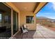 Covered patio with outdoor seating, providing a peaceful retreat and scenic neighborhood vistas at 260 Haley Way # 157, Mesquite, NV 89027