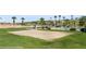 Outdoor sand volleyball court surrounded by well-manicured lawns and lush green landscaping at 260 Haley Way # 157, Mesquite, NV 89027