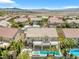 Gorgeous aerial view of a home with a pool and backyard deck in a desert neighborhood at 3088 Via Flaminia Ct, Henderson, NV 89052