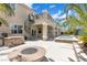 Outdoor patio features a fire pit, outdoor kitchen, and a second-story balcony with spiral staircase at 3088 Via Flaminia Ct, Henderson, NV 89052
