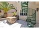 Cozy backyard featuring a built-in grill and unique spiral staircase leading to upper level at 3088 Via Flaminia Ct, Henderson, NV 89052