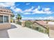 Large balcony with wrought-iron railing and city views in the distance at 3088 Via Flaminia Ct, Henderson, NV 89052