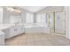 Bathroom features a soaking tub, walk-in shower, vanity, and tile flooring at 3088 Via Flaminia Ct, Henderson, NV 89052