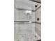 Walk-in shower with decorative tile, a rainfall shower head, and built-in niche at 3088 Via Flaminia Ct, Henderson, NV 89052