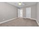 Neutral bedroom with a ceiling fan, plush carpeting, and ensuite bathroom at 3088 Via Flaminia Ct, Henderson, NV 89052