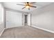 Bedroom with plush carpet, ceiling fan, closet and bright window with shutters at 3088 Via Flaminia Ct, Henderson, NV 89052