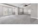 Spacious bedroom with neutral colored carpet, overhead fan, and private patio access at 3088 Via Flaminia Ct, Henderson, NV 89052