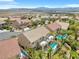 Exterior view of the home with a pool and a spacious balcony overlooking the backyard oasis at 3088 Via Flaminia Ct, Henderson, NV 89052