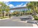 Grand entrance gate to the community featuring manicured landscaping and architectural details at 3088 Via Flaminia Ct, Henderson, NV 89052