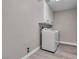 Laundry room features a washer, dryer, overhead cabinets, and laminate floors at 3088 Via Flaminia Ct, Henderson, NV 89052