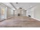 Spacious living room features a fireplace, wood floors, and built in shelves at 3088 Via Flaminia Ct, Henderson, NV 89052