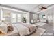 Main bedroom with vaulted ceilings, a ceiling fan, and private balcony at 3088 Via Flaminia Ct, Henderson, NV 89052