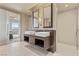 Modern bathroom with double sinks, sleek cabinetry, and a walk-in shower at 3750 Las Vegas Blvd # 3510, Las Vegas, NV 89158