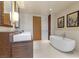 Elegant bathroom with a soaking tub, double sinks, and modern fixtures at 3750 Las Vegas Blvd # 3510, Las Vegas, NV 89158