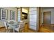 Elegant dining area featuring a glass table, kitchen access, and modern accents at 3750 Las Vegas Blvd # 3510, Las Vegas, NV 89158