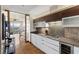 Modern kitchen with stainless steel appliances, sleek white cabinets, and hardwood floors at 3750 Las Vegas Blvd # 3510, Las Vegas, NV 89158
