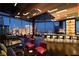 Elegant lounge showcasing luxurious seating, a modern bar, and panoramic views of the Las Vegas Strip at night at 3750 Las Vegas Blvd # 3510, Las Vegas, NV 89158