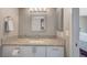Bathroom featuring granite countertop, mirror, and neutral finishes at 3823 S Maryland Pkwy # T8, Las Vegas, NV 89119