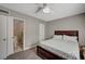 Bedroom featuring ceiling fan, carpet and an adjacent bathroom at 3823 S Maryland Pkwy # T8, Las Vegas, NV 89119