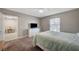 Comfortable bedroom featuring neutral walls, ceiling fan, and view of an adjacent dining area at 3823 S Maryland Pkwy # T8, Las Vegas, NV 89119