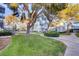 Exterior featuring a lush grassy lawn and mature trees at 3823 S Maryland Pkwy # T8, Las Vegas, NV 89119