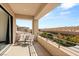 Balcony features outdoor seating and views of the neighborhood and desert landscape at 39 Coralwood Dr, Las Vegas, NV 89135