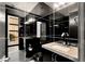 Modern bathroom with unique mirror accents, a sleek vanity, and a private garden view at 39 Coralwood Dr, Las Vegas, NV 89135