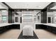 Spacious bathroom featuring dual vanities, a modern soaking tub, and contemporary mirrors at 39 Coralwood Dr, Las Vegas, NV 89135