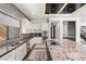 Contemporary kitchen featuring granite countertops, stainless steel appliances, and ample storage at 39 Coralwood Dr, Las Vegas, NV 89135