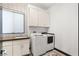Efficient laundry room with modern washer and dryer, plus ample storage at 39 Coralwood Dr, Las Vegas, NV 89135