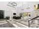 Elegant living room with soaring ceilings, a fireplace, and seamless indoor-outdoor flow to the backyard at 39 Coralwood Dr, Las Vegas, NV 89135