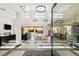 Bright and spacious living room featuring a high ceiling, contemporary lighting, and an open floor plan at 39 Coralwood Dr, Las Vegas, NV 89135