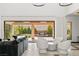 Stylish living room with a modern fireplace, comfortable seating, and seamless access to an outdoor fire pit at 39 Coralwood Dr, Las Vegas, NV 89135