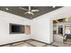 Bright, modern living room featuring a stylish ceiling, and a granite-counter wet bar area at 39 Coralwood Dr, Las Vegas, NV 89135