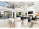 Modern living area with high ceilings, a sleek fireplace, and an open layout that is great for entertaining at 39 Coralwood Dr, Las Vegas, NV 89135