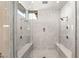 Modern shower with dual shower heads and seating at 39 Coralwood Dr, Las Vegas, NV 89135