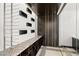 Modern wine cellar featuring custom storage, granite countertop, and wine racks at 39 Coralwood Dr, Las Vegas, NV 89135