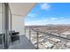 Balcony view overlooking cityscape with mountain views, featuring seating and glass railings at 4381 W Flamingo Rd # 38303, Las Vegas, NV 89103