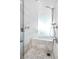 Modern bathroom featuring a walk-in shower, soaking tub, and elegant white marble tiling at 4381 W Flamingo Rd # 38303, Las Vegas, NV 89103