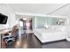 Cozy bedroom with sleek furniture, including a desk, and a view of the kitchen area at 4381 W Flamingo Rd # 38303, Las Vegas, NV 89103