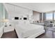 Bright bedroom with plush bed, mirrored wall, and a comfortable seating area by the window at 4381 W Flamingo Rd # 38303, Las Vegas, NV 89103