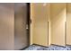Hallway with decorative carpeting leading to a door with a keypad entry system at 4381 W Flamingo Rd # 38303, Las Vegas, NV 89103